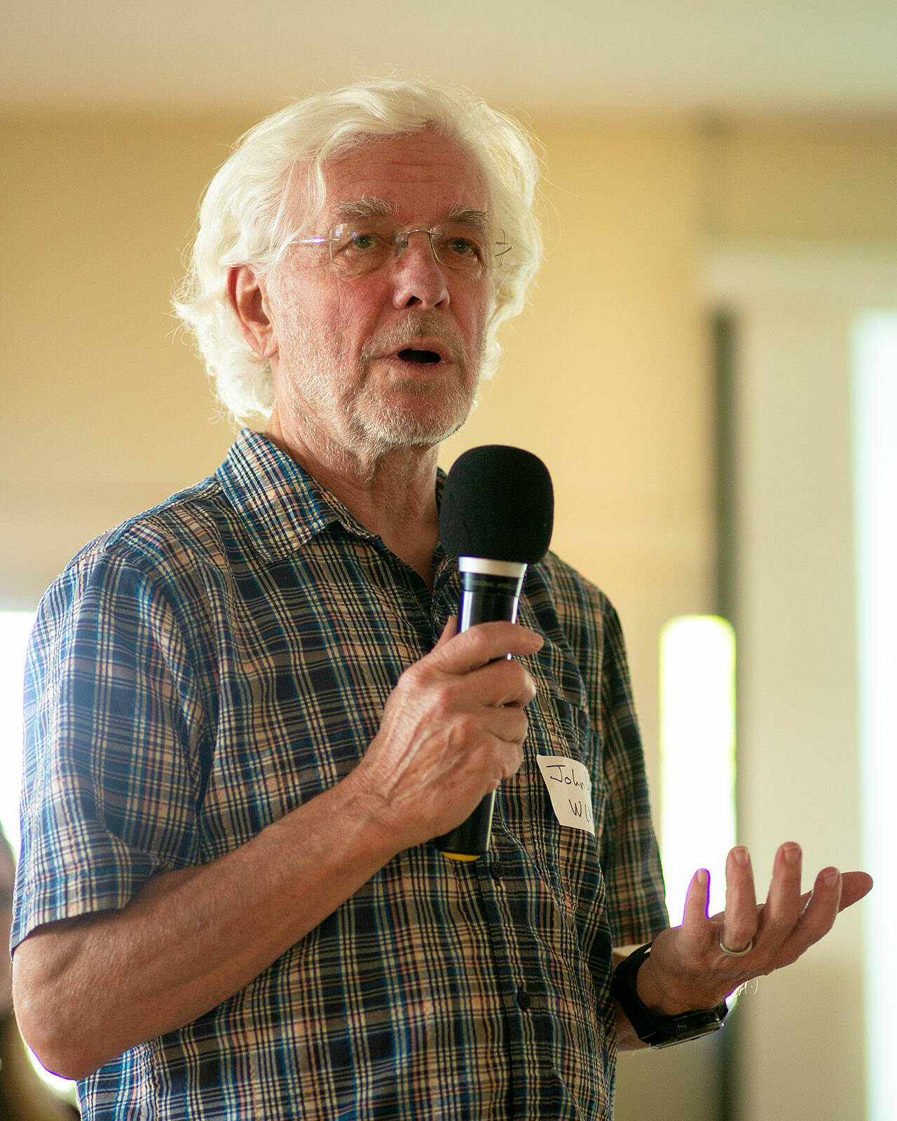 John Lovie, director of the Whidbey Island Water Systems Association, helps answer questions regarding PFAS found at sites on Whidbey Island during a public meeting on June 22, 2023, at the Coupeville Recreation Hall in Coupeville, Washington. (Ryan Berry / The Herald)
