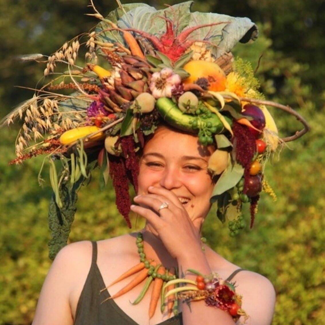 Organic Farm School student Carly Zierke in a creation made by floral designer Tobey Nelson and a dress from edit, a Langley business. (Photo by Clancy Dunigan)