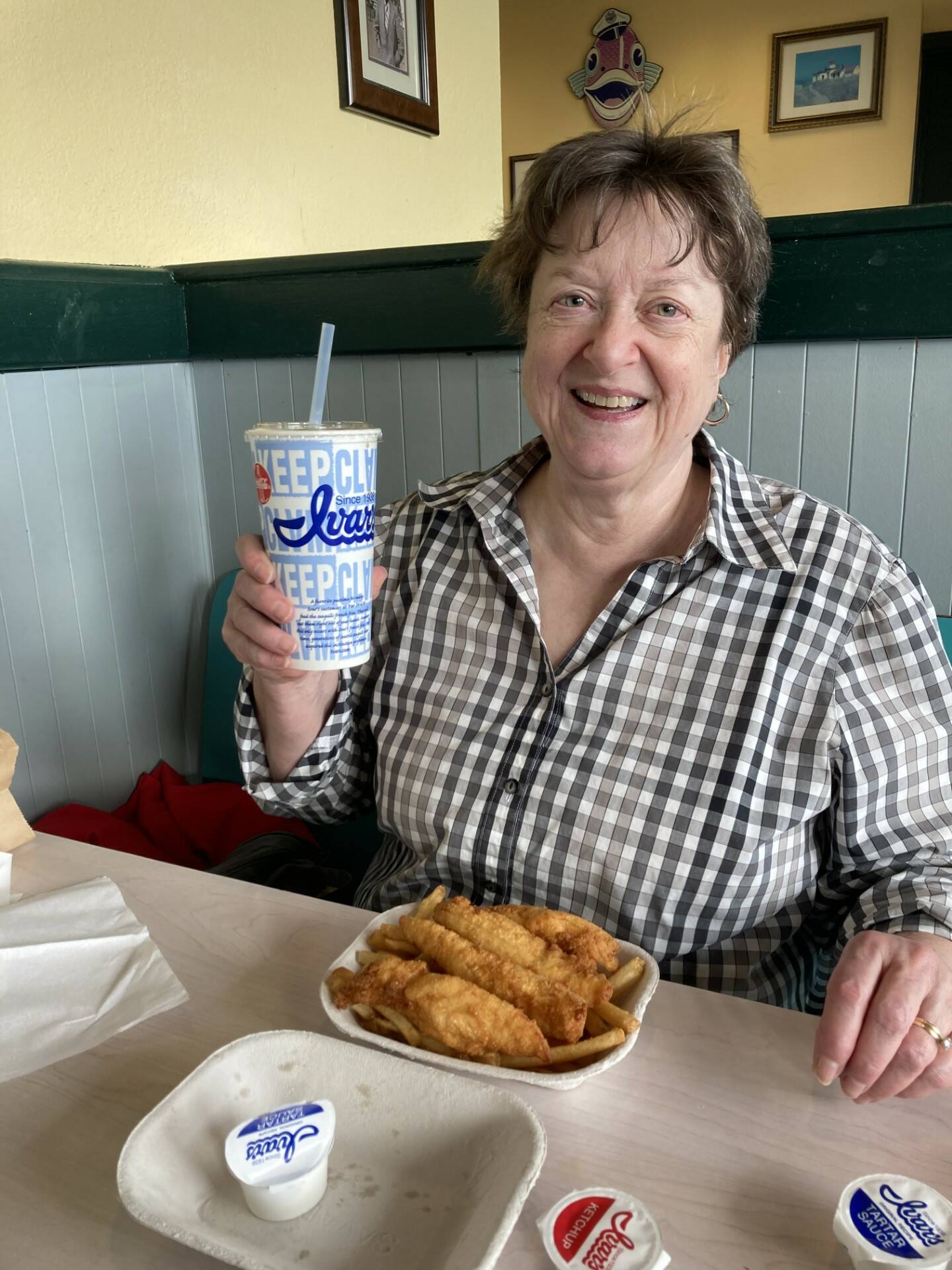 Deb, Eric Arnold’s wife, enjoys some free fish and chips courtesy of Ivar’s. (Photo provided)