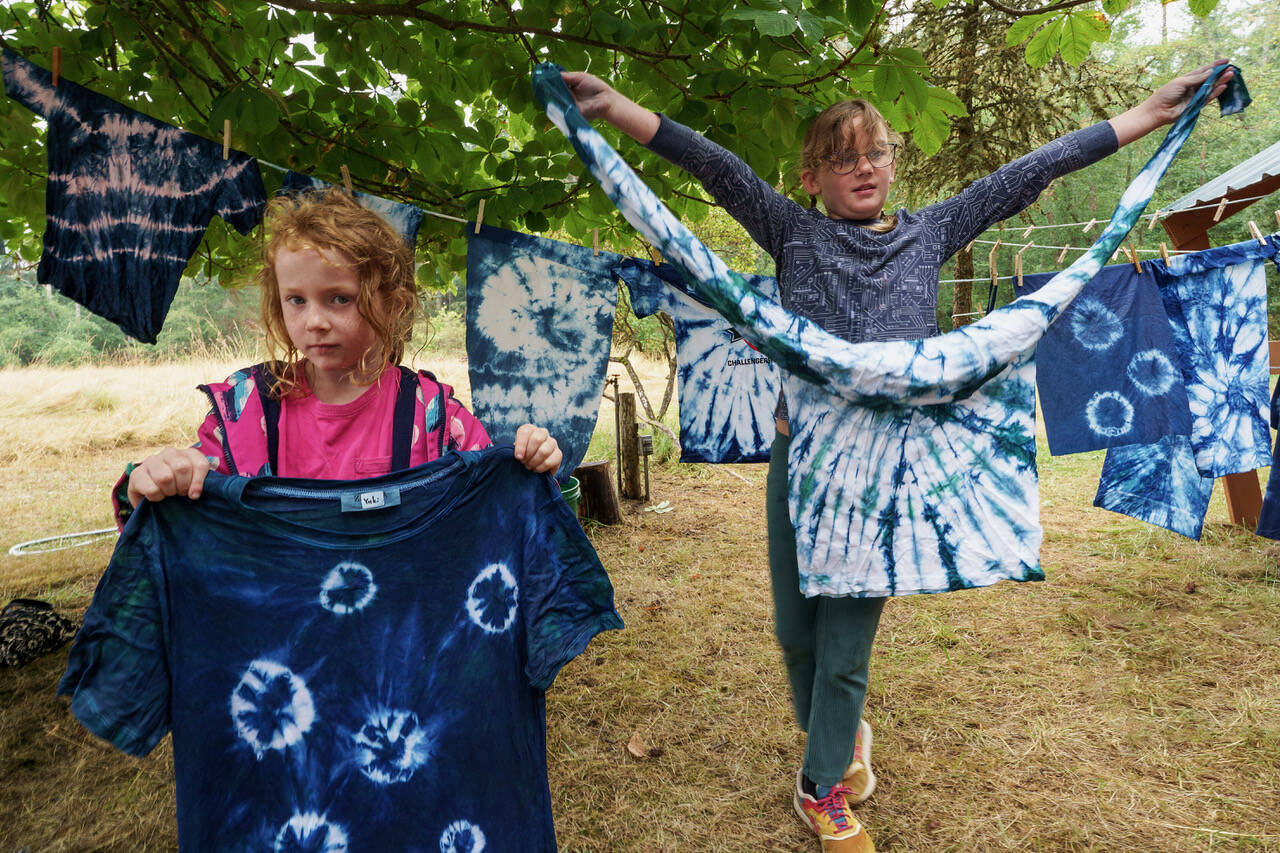 Photo by David Welton
Natalie Knauss, 6, from Seattle and Sally Gibbs, 8, from Edmonds show off tie-dyed shirts made at Green Arts Camp Aug. 9.