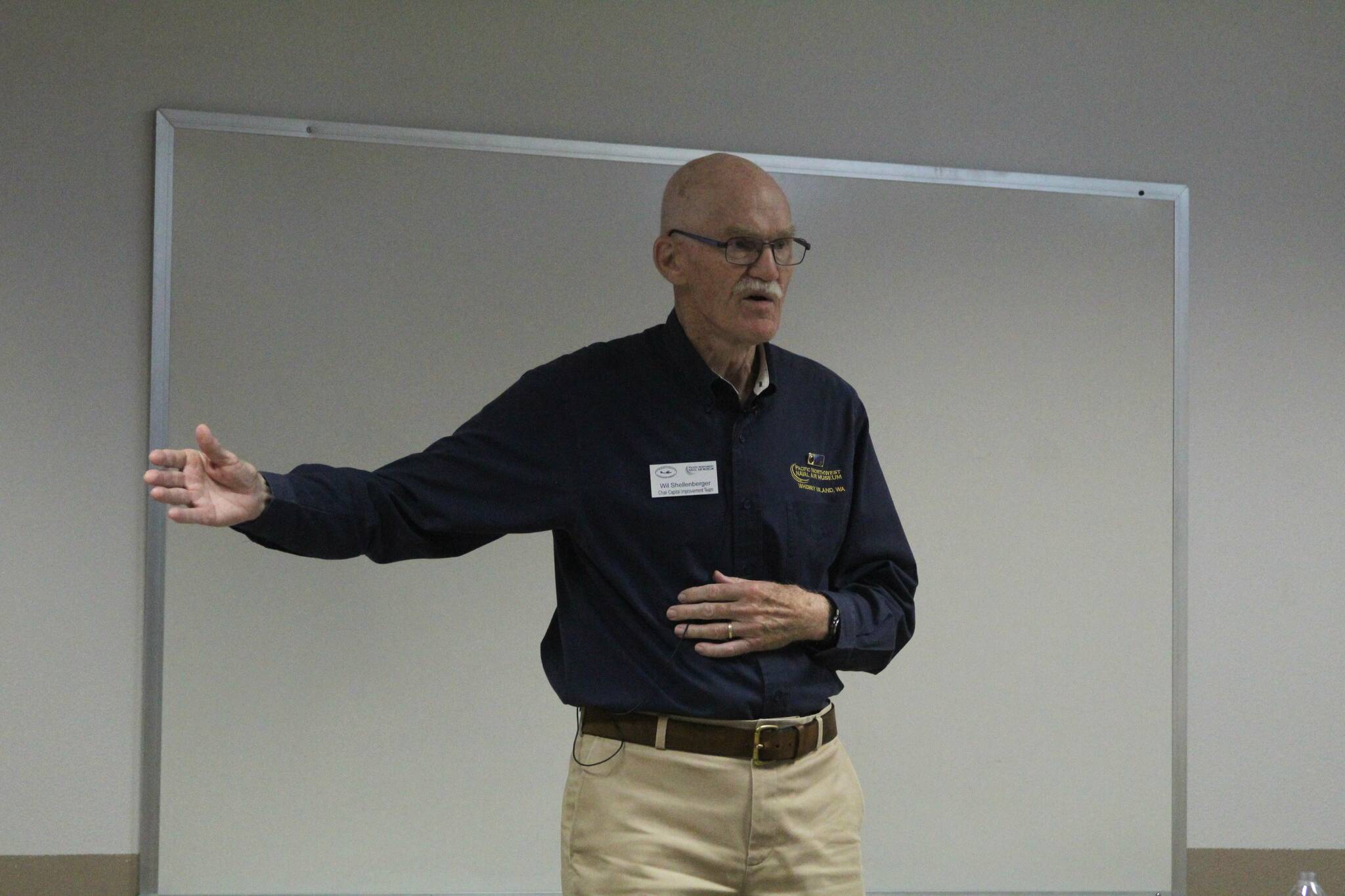 Wil Shellenberger delivers a presentation on the history of the Pacific Northwest Naval Air Museum at the Oak Harbor Library Aug. 17. (Photo by Karina Andrew/Whidbey News-Times)