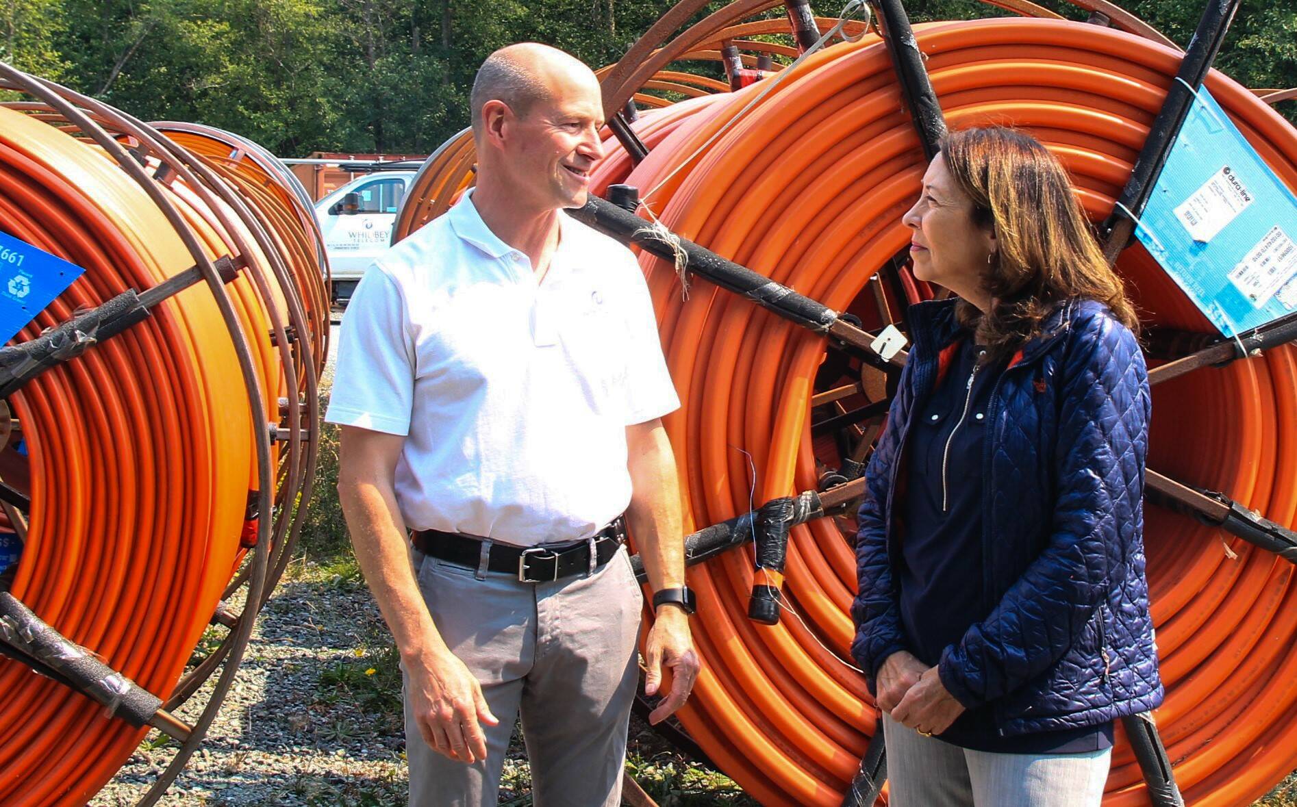 Cantwell speaks with Whidbey Telecom Co-CEO George Henny. (Photo by Luisa Loi/Whidbey News-Times)