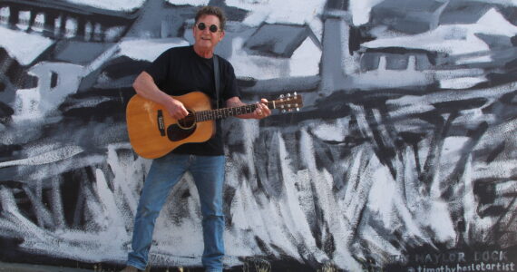 Photo by Karina Andrew/Whidbey News-Times
Larry Mason plays guitar in downtown Oak Harbor.