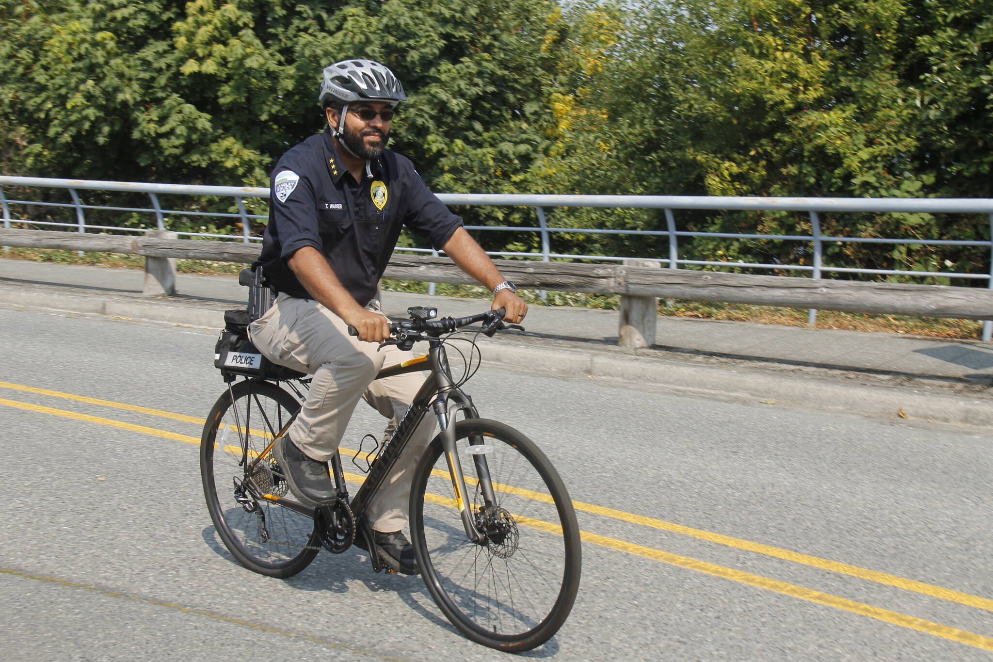 Photo by Kira Erickson/South Whidbey Record
Langley Police Chief Tavier Wasser cycles down First Street in the Village by the Sea.