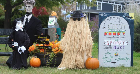 Members of the Addams Family take up residence in Cook’s Corner Park for Coupeville’s annual scarecrow competition. (Photo by Karina Andrew/Whidbey News-Times)