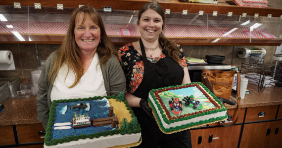 Photo by David Welton
Pia Stewart and Jennifer Holmes showcase some of their most creative cake displays, which include a Whidbey theme with a ferry dock made out of Kit Kats and Mario Kart characters.