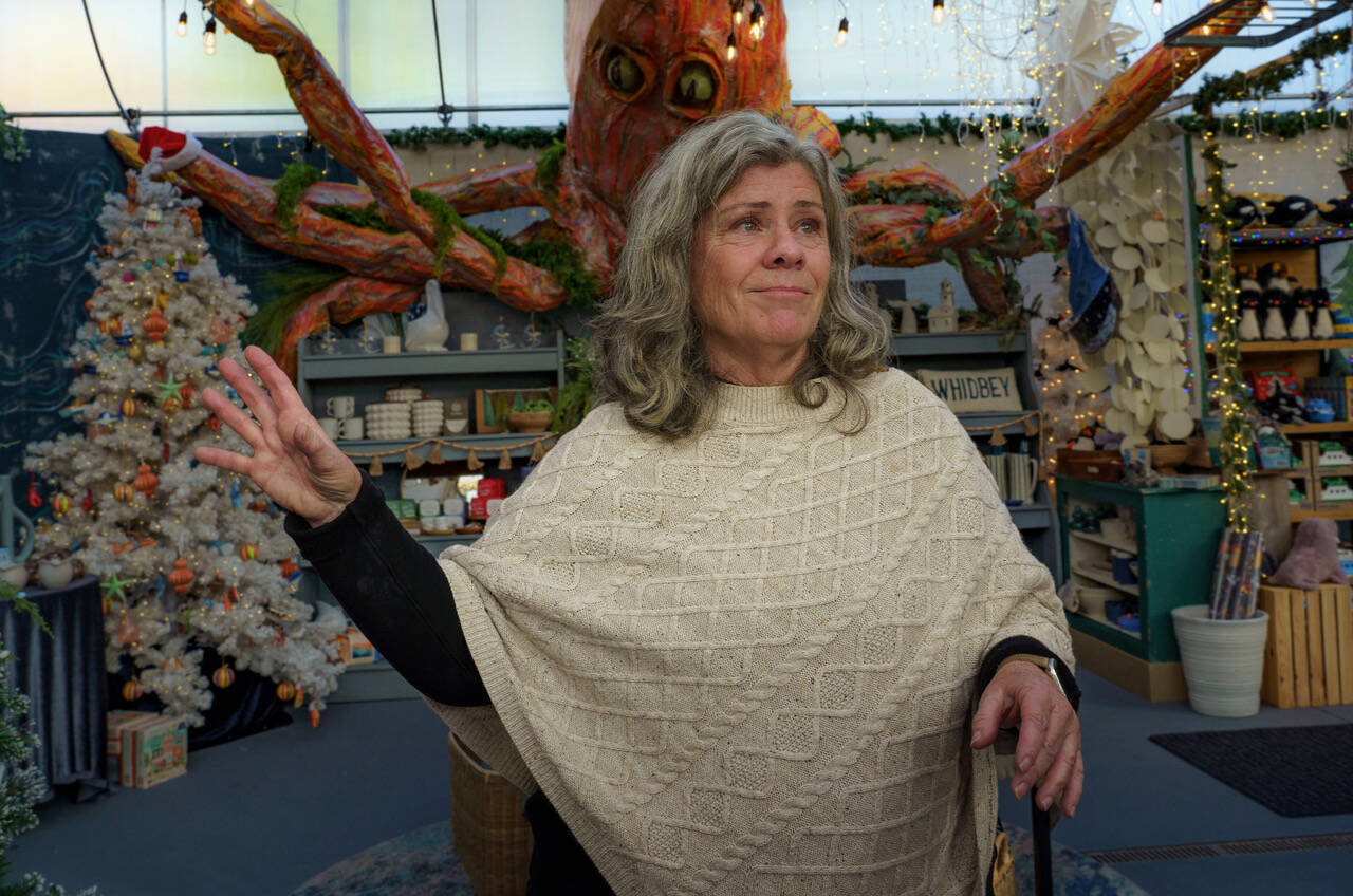 Maureen Murphy with the giant octopus made by Bayview Garden employee Randy Landon. (Photo by David Welton)