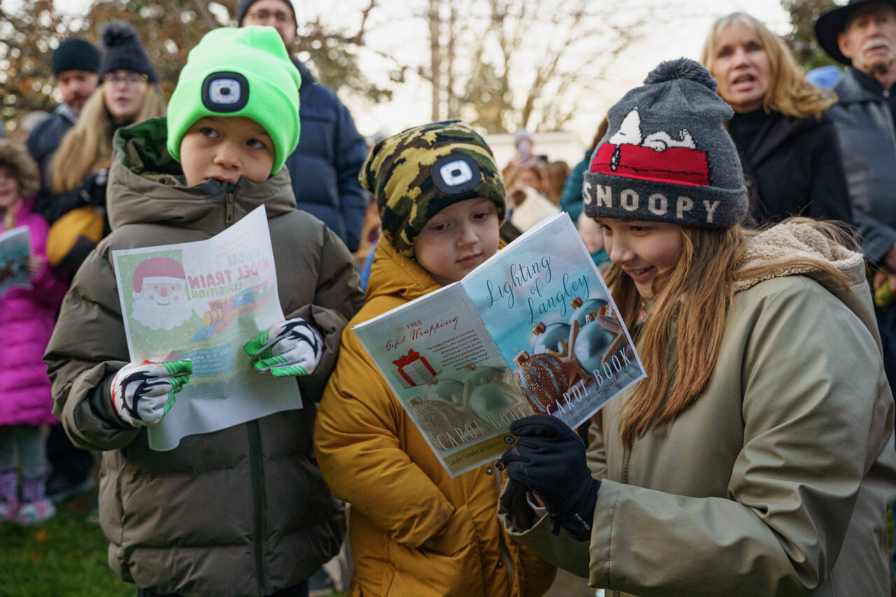 A group of young carolers joins in on the fun. (Photo by David Welton)