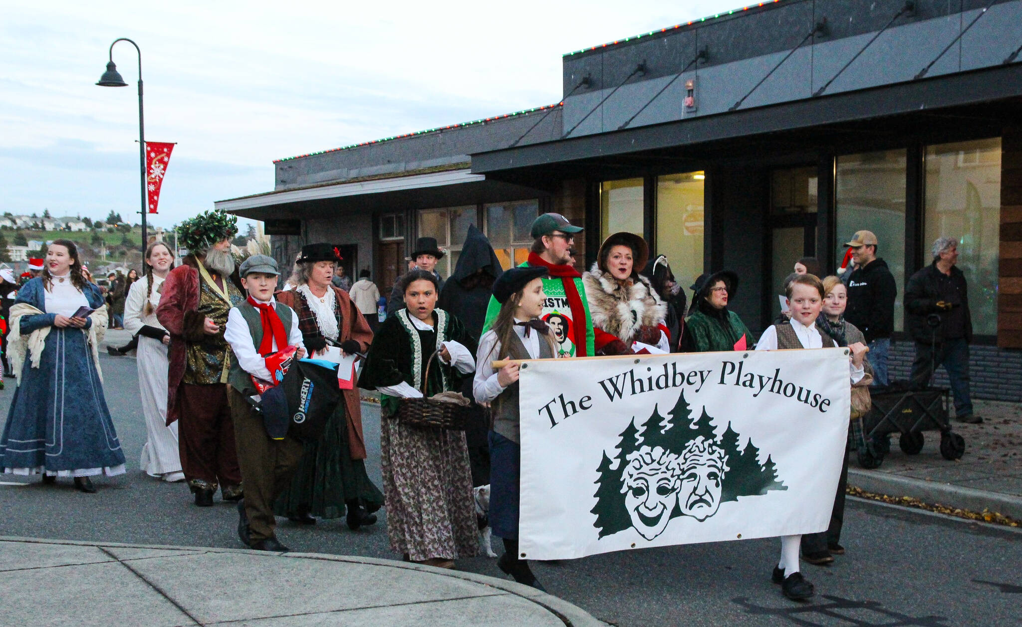 The Whidbey Playhouse joined Santa’s parade as characters from “A Christmas Carol.” (Photo by Luisa Loi)