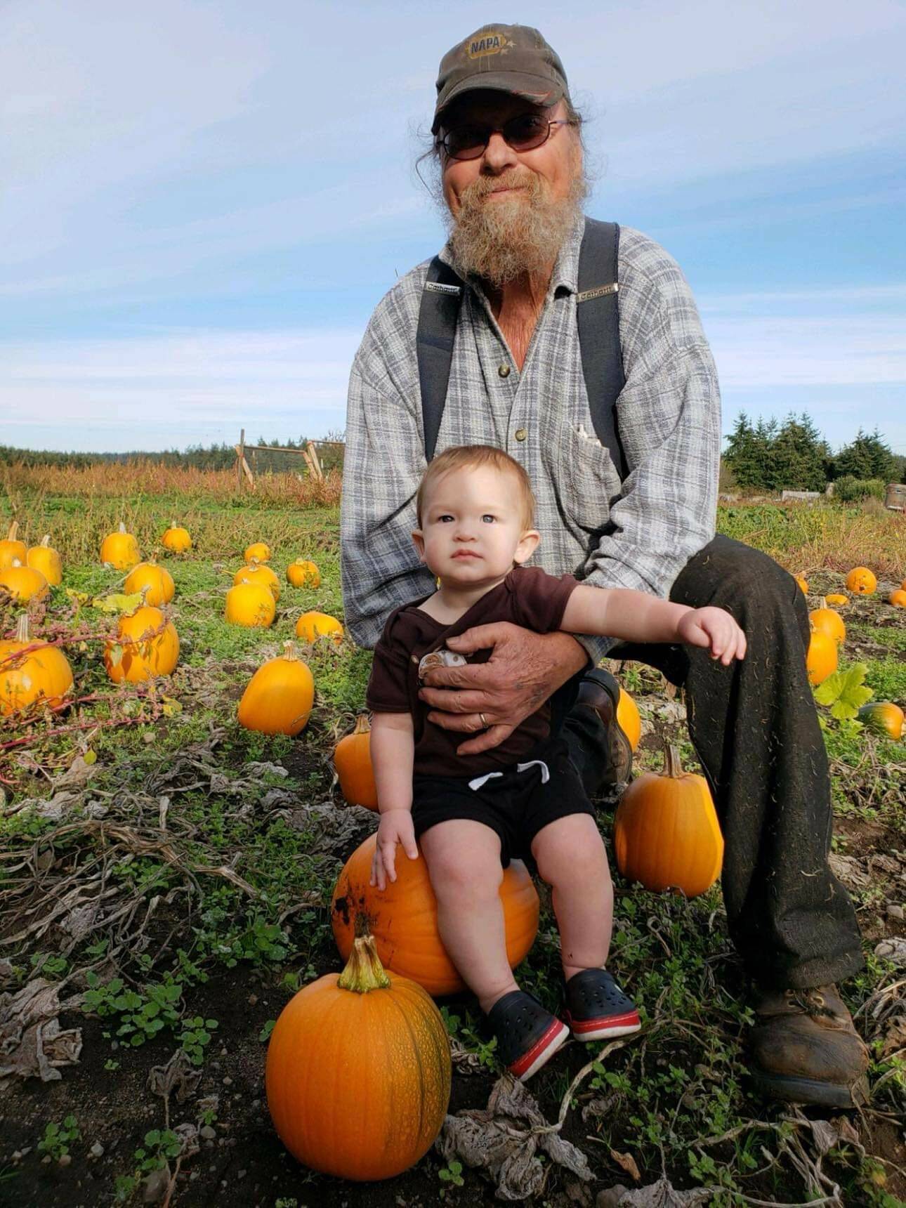 Mike Case-Smith introduces his grandson, Dean, to the pumpkin patch. (Photo provided)