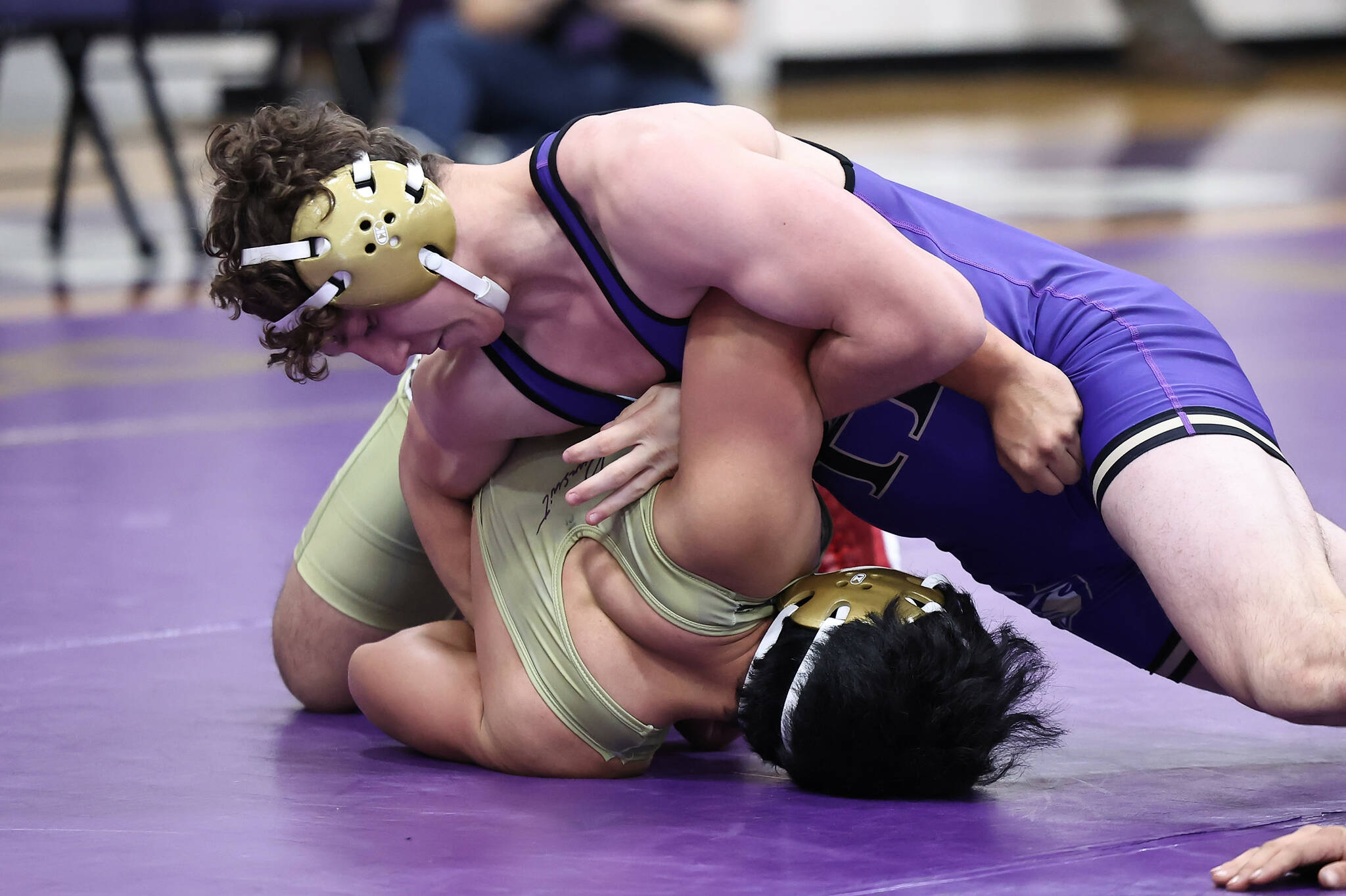 Oak Harbor wrestlers junior Ronnie Grabner competes against Tony Valle during the Purple and Gold event. (Photo by John Fisken)