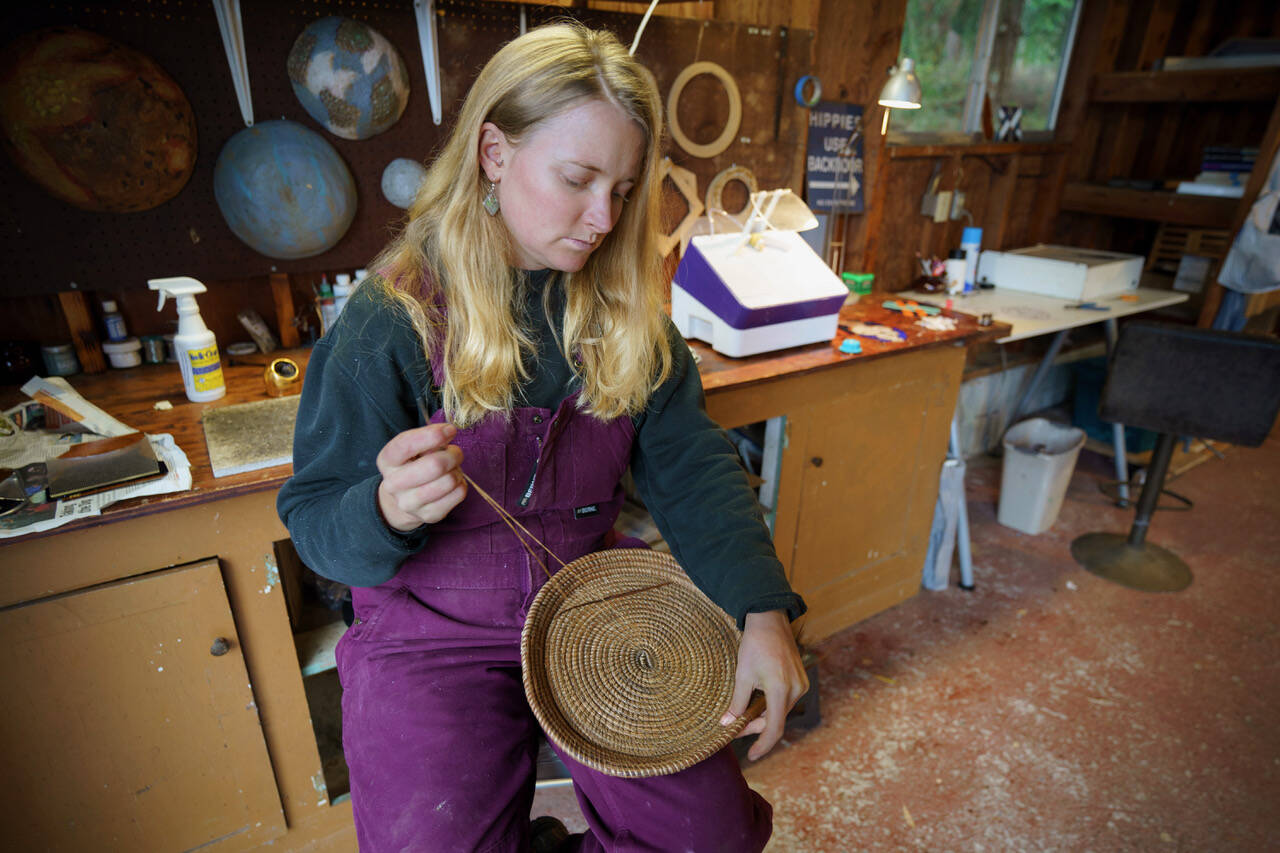 Besides stained glass pieces, Bennett also weaves baskets from pine needles. (Photo by David Welton)