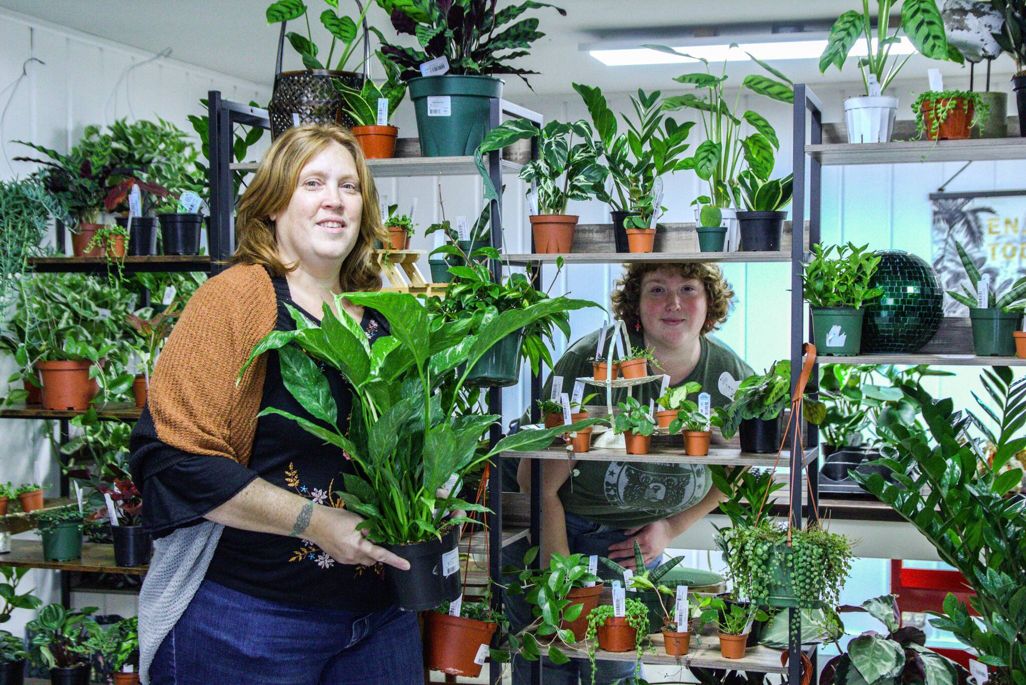 Geneva Blackmer and her daughter, Tanzi, at right, have always collected and taken care of house plants as a hobby. Now, they turned their passion into a business. (Photo by Luisa Loi)