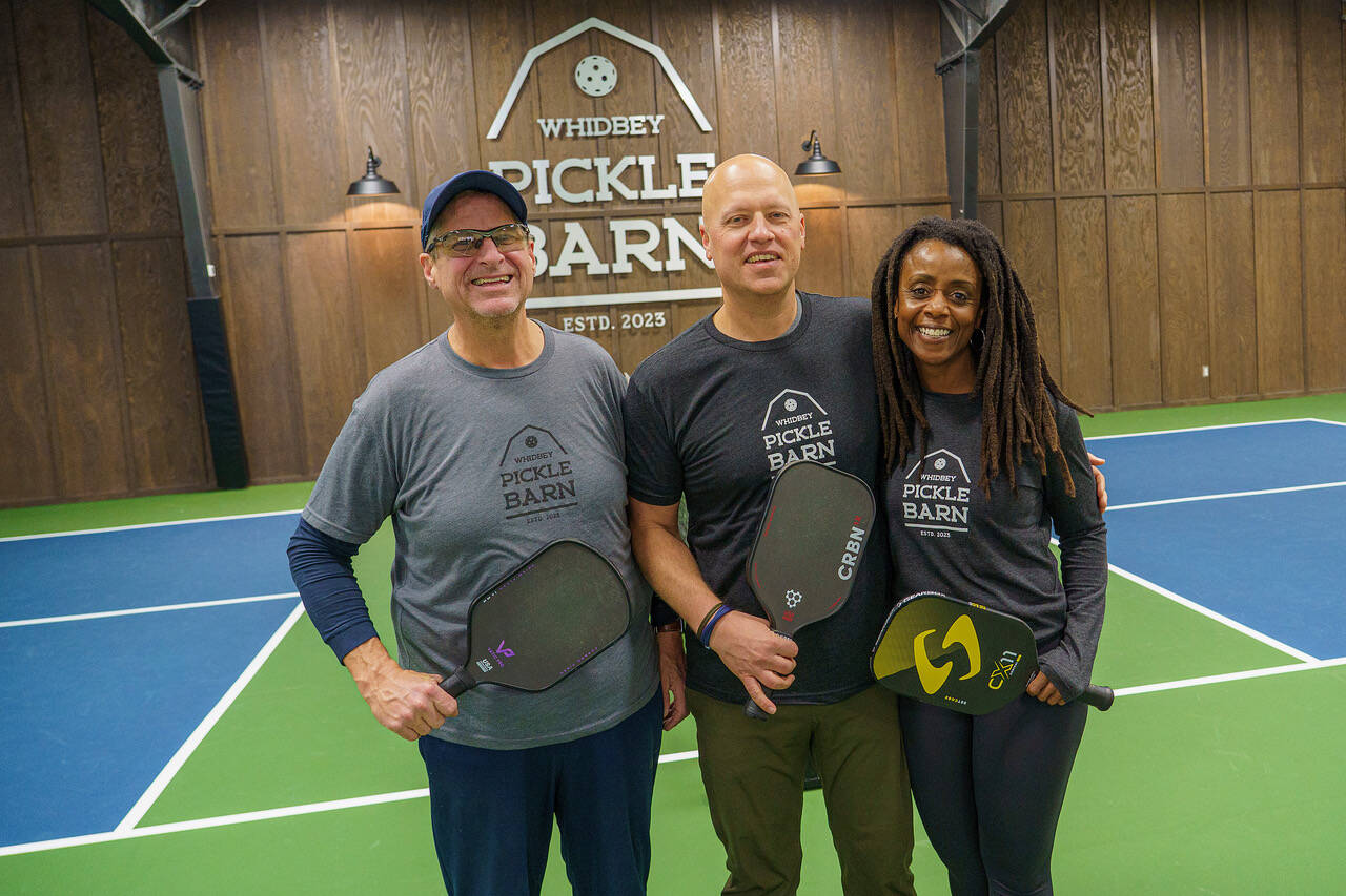 Timm Sanford, left, is an instructor at Whidbey Pickle Barn, which Paul, middle, and Abi Tschetter own. (Photo by David Welton)