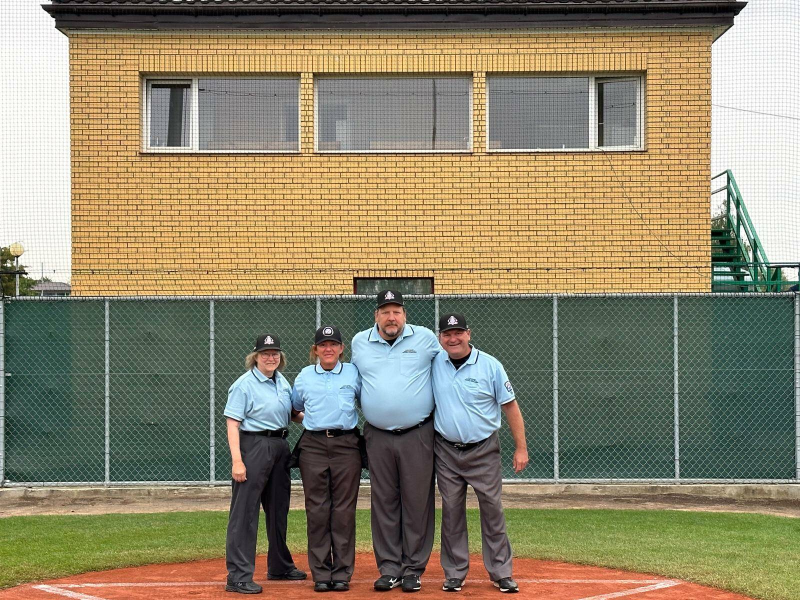 Rita Cline, left, stands with umpires from Italy, Chicago and France who officiated games in Kutno, Poland during the regional tournament of the Little League World Series in July. She has been an umpire for the North Whidbey Little League for the past 26 years. (Photo courtesy of Rita Cline)