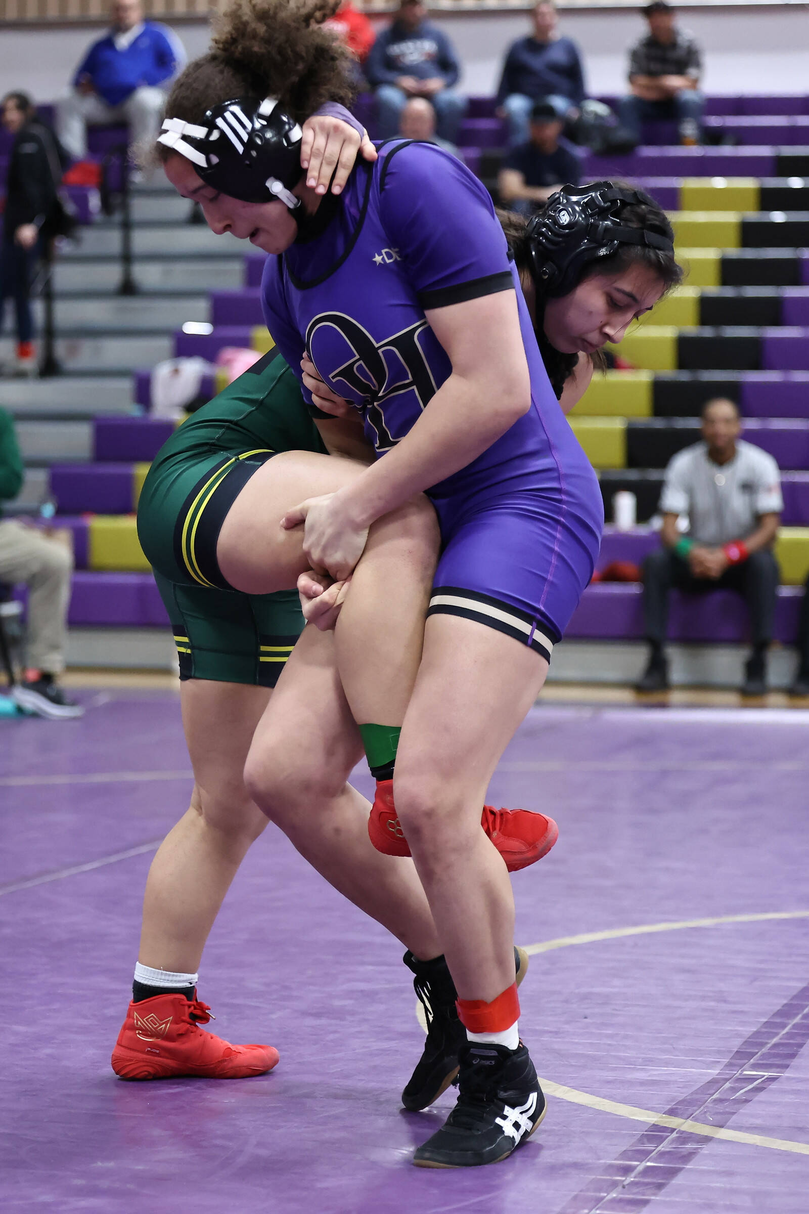 Oak Harbor’s Brianna Richard wrestles an opponent during the Rock Island Rumble tournament that took place Saturday at Oak Harbor High School. Richard placed first in the 135-pound weight class. (Photo by John Fisken)