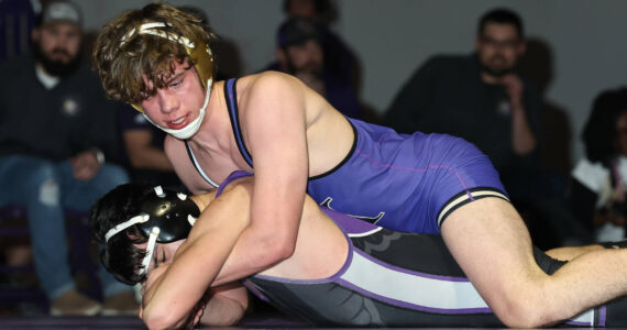 Oak Harbor’s Joel Christopherson wrestles an opponent from Anacortes during a match Wednesday at Oak Harbor High School. (Photo by John Fisken)
