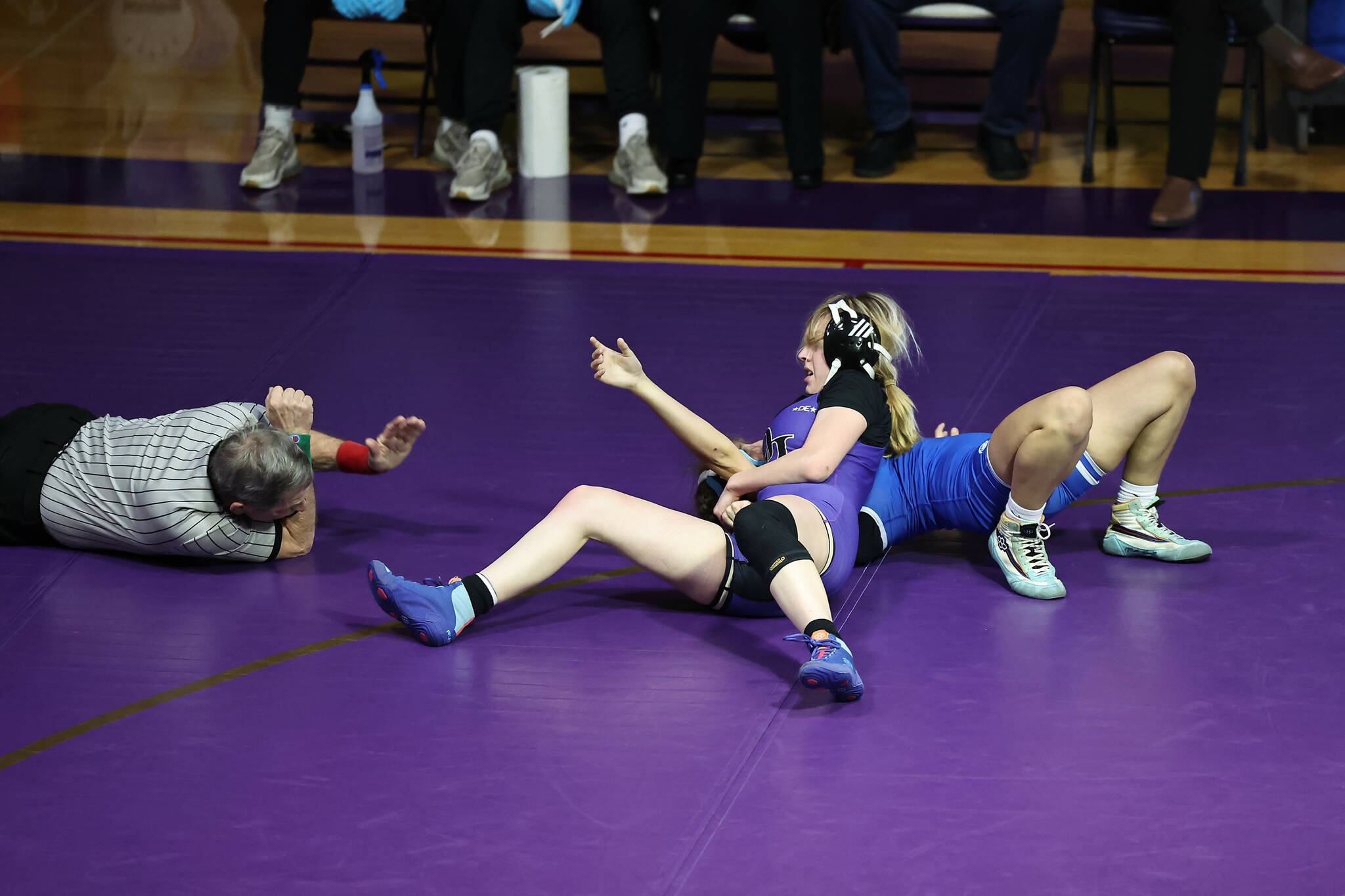 Oak Harbor senior Danielle Kanterman tries to pin her opponent during the Northwest Conference dual meet held Jan. 25 at Oak Harbor High School. She eventually won her match and the Wildcats captured the conference championship. (Photo by John Fisken)