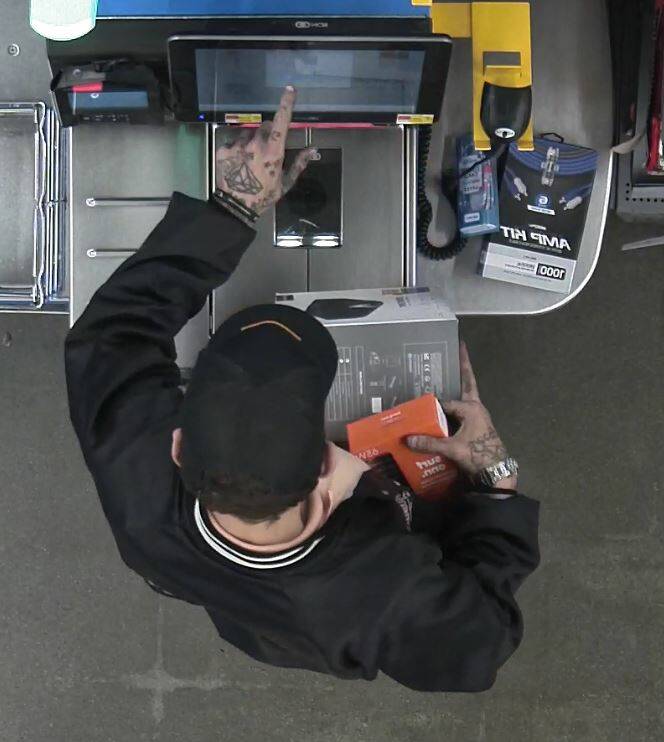 Oak Harbor Walmart surveillance footage showing a suspect in a theft case who was identified by his tattoos. (Photo courtesy of the Oak Harbor Police Department)