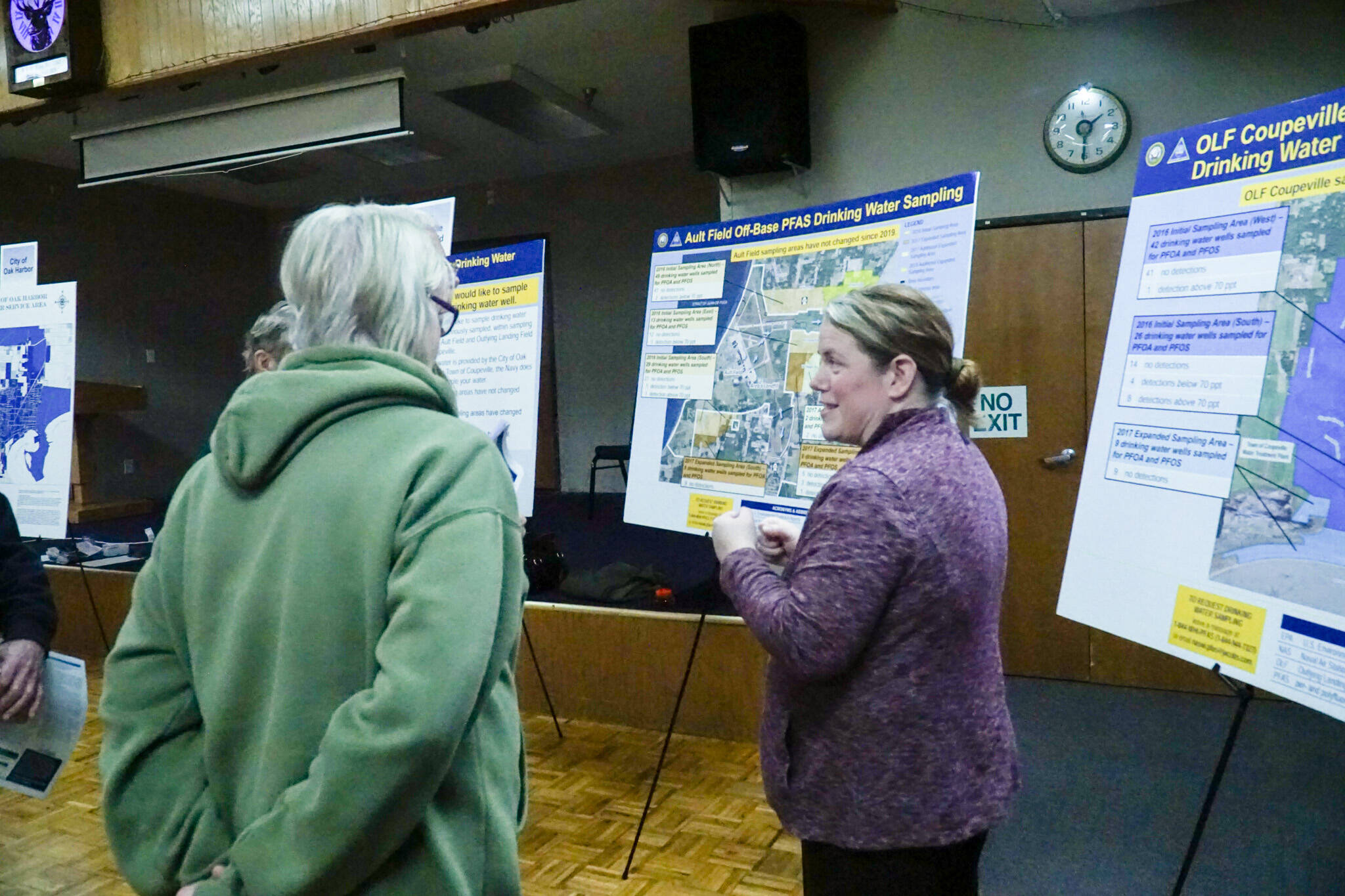 Oak Harbor resident Denese Kjargaard (left) hears from NFEC NW Remedial Project Manager Laura Himes (right) about the previous and future PFAS sampling areas. (Photo by Sam Fletcher)