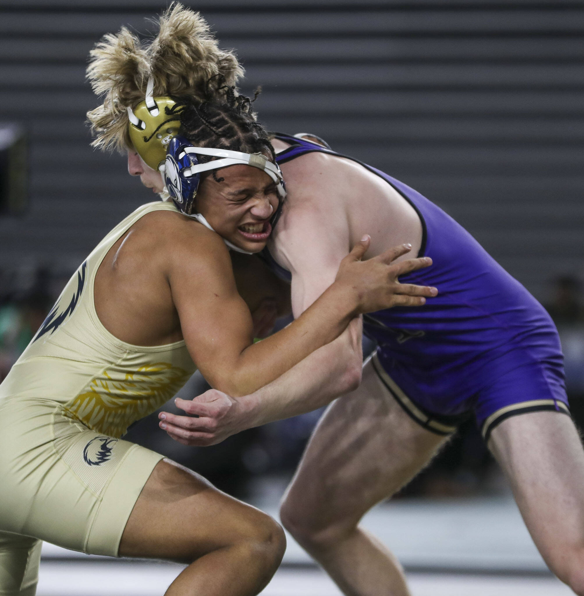 Arlington’s Tre Haines and Oak Harbor's Percie Hatfield wrestle during the 3A boys 157-pound championship match during Mat Classic XXXV on Saturday, Feb. 17, 2024, at the Tacoma Dome in Tacoma. (Annie Barker / The Herald)