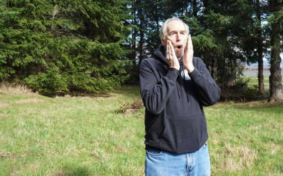 Photo by Sam Fletcher
Whidbey bigfoot researcher David Ellis emulated a tree knock with his mouth outside Langley.