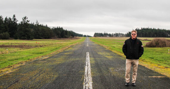 Photo by Luisa Loi
Robert DeLaurentis stands on the 3,250 feet long runway at DeLaurentis International Airport. The aviator is hoping to purchase a property to add more lenght to the runway, which also needs to be repaved and widened.