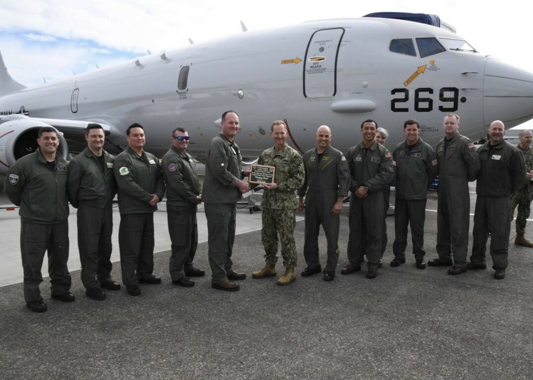 Cmdr. James Tilden, Commanding Officer of Patrol Squadron 62, presents a dedication plaque to Vice Adm. John B. Mustin, Chief of Navy Reserve and Commander, Navy Reserve Force, after taking delivery of the first new P-8A Poseidon for the Naval Air Force Reserve during a ceremony at Boeing Military Delivery Facility in Tukwila, Washington, March 6, 2024. This first delivery of the new P-8A Poseidon is a historic moment as it is the first purpose-built aircraft sent directly to the Navy Reserve’s defense architecture in its aggressive transformation as an elite warfighting organization. Our patrol aircraft deploy and operate globally in support of national defense priorities executing myriad missions ranging from supporting homeland defense (HLD), participating in exercises sustaining fleet readiness, and work alongside partner and allied nations maintaining proficiency and increasing interoperability. (Photo courtesy of the US Naval Air Force Reserve)