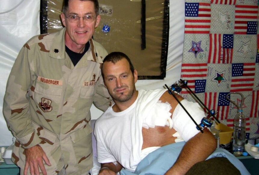 <p>Photo courtesy of Jeffrey Neuberger</p>
                                <p>Chaplain, Lt Col, USAF (Ret) Jeffrey Neuberger stands with a wounded soldier, Gareth Evans, in Iraq.</p>