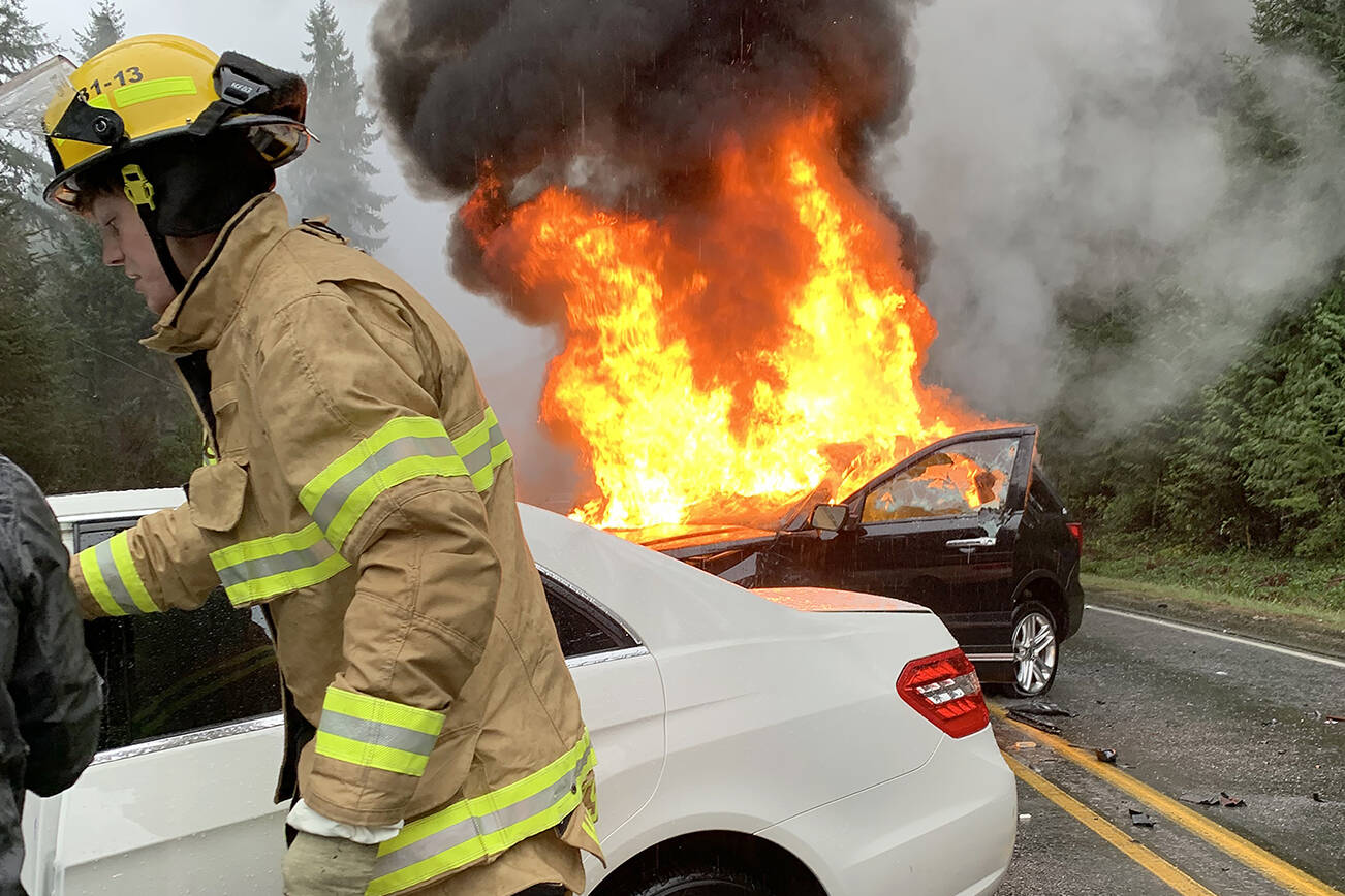 A fatal accident the afternoon of Dec. 18 near Clinton ended with one of the cars involved bursting into flames. The driver of the fully engulfed car was outside of the vehicle by the time first responders arrived at the scene. (Whidbey News-Times/Submitted photo)