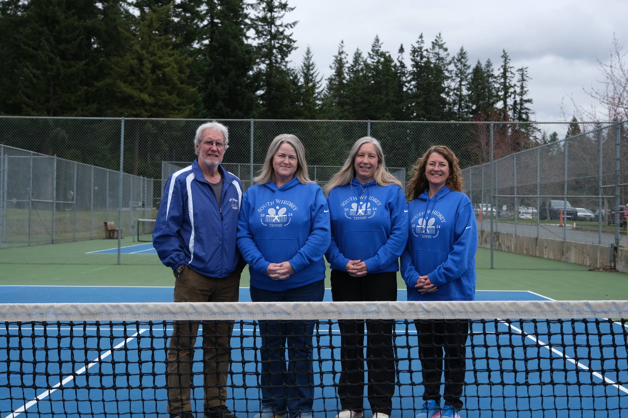 South Whidbey’s girls tennis coaches will retire at the end of the season. Pictured from left are volunteer Tom Kramer, who coached from 1978-2012, current coach Karyle Kramer and assistant coaches Bess Windecker-Nelson and Jenny Gochanour. (Photo by Nathan Whalen)
