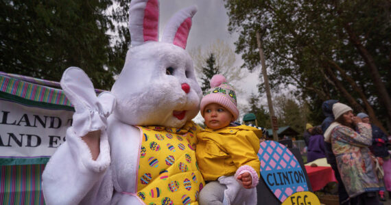 Photo by David Welton
A toddler is suspicious of the Easter Bunny during last year’s egg hunt in Clinton.