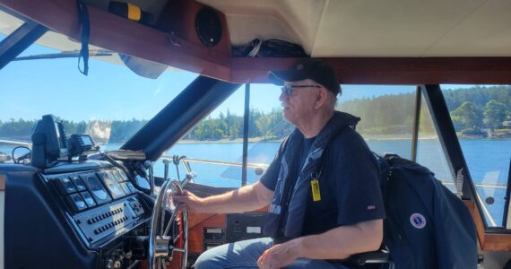Photo courtesy of Jerry Liggett
Deception Pass Sail & Power Squadron Commander Jerry Liggett captains a boat on the Salish Sea.