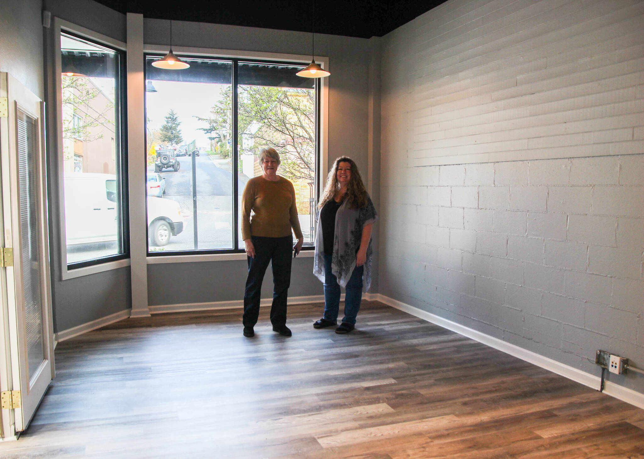 Photo by Luisa Loi
Margaret Livermore and Teresa Besaw stand in the approximately 225-square-foot business incubator at the Main Street Association’s new location on Pioneer Way.