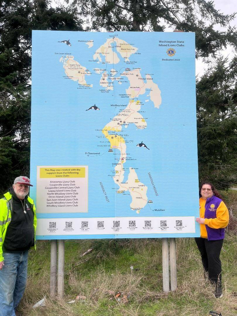 Patrick Hussey and Carolyn ODell pose with the newly installed map. (Photo provided)