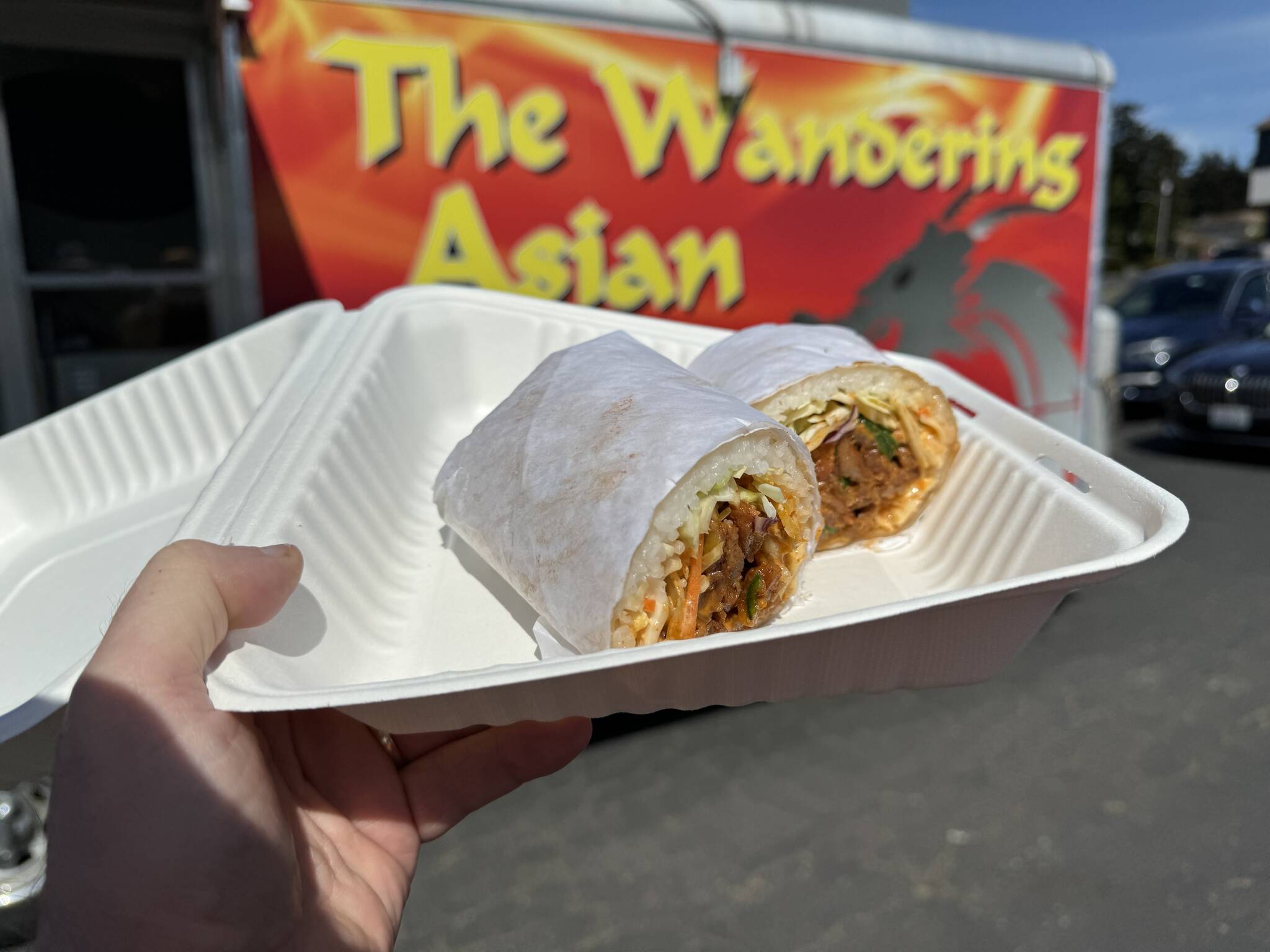 The Wandering Asian marinates their meats in secret family sauces, then wraps them with rice, purple cabbage, carrots, cilantro and more. (Photo provided)