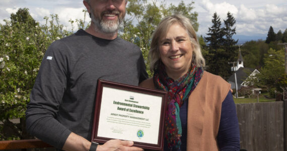 USDA photo by Phil Eggman
Arndt Property Management owner Damon Arndt is presented with the USDA Rural Development’s Environmental Stewardship Award of Excellence by State Director Helen Price Johnson for his company’s use of renewable energy at their business in Langley.