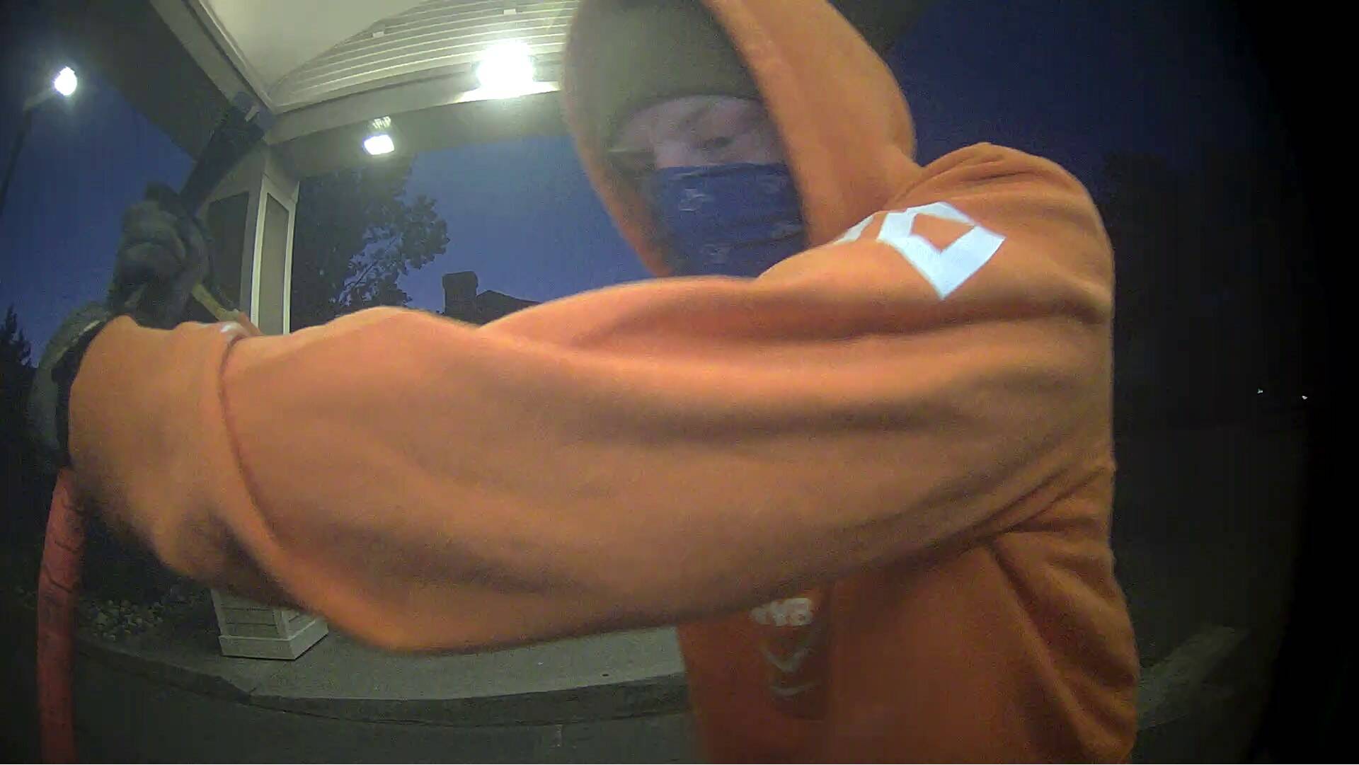 An image shows a suspect trying to break into an ATM.