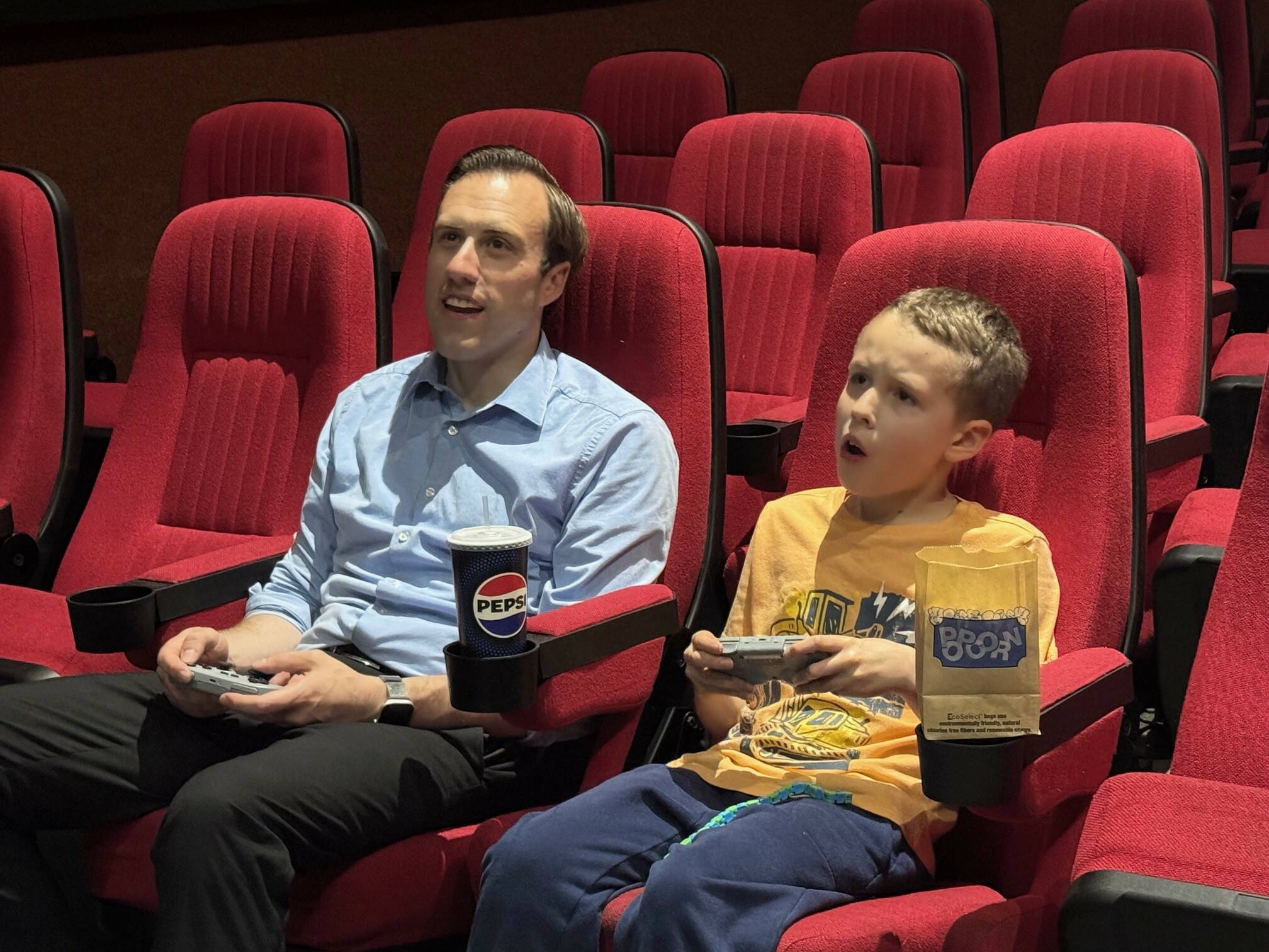 (Photo provided) Bryan Stucky and his son Ben Stucky are locked in on a competitive Mario Kart game, with butter popcorn and a refreshment at the ready.