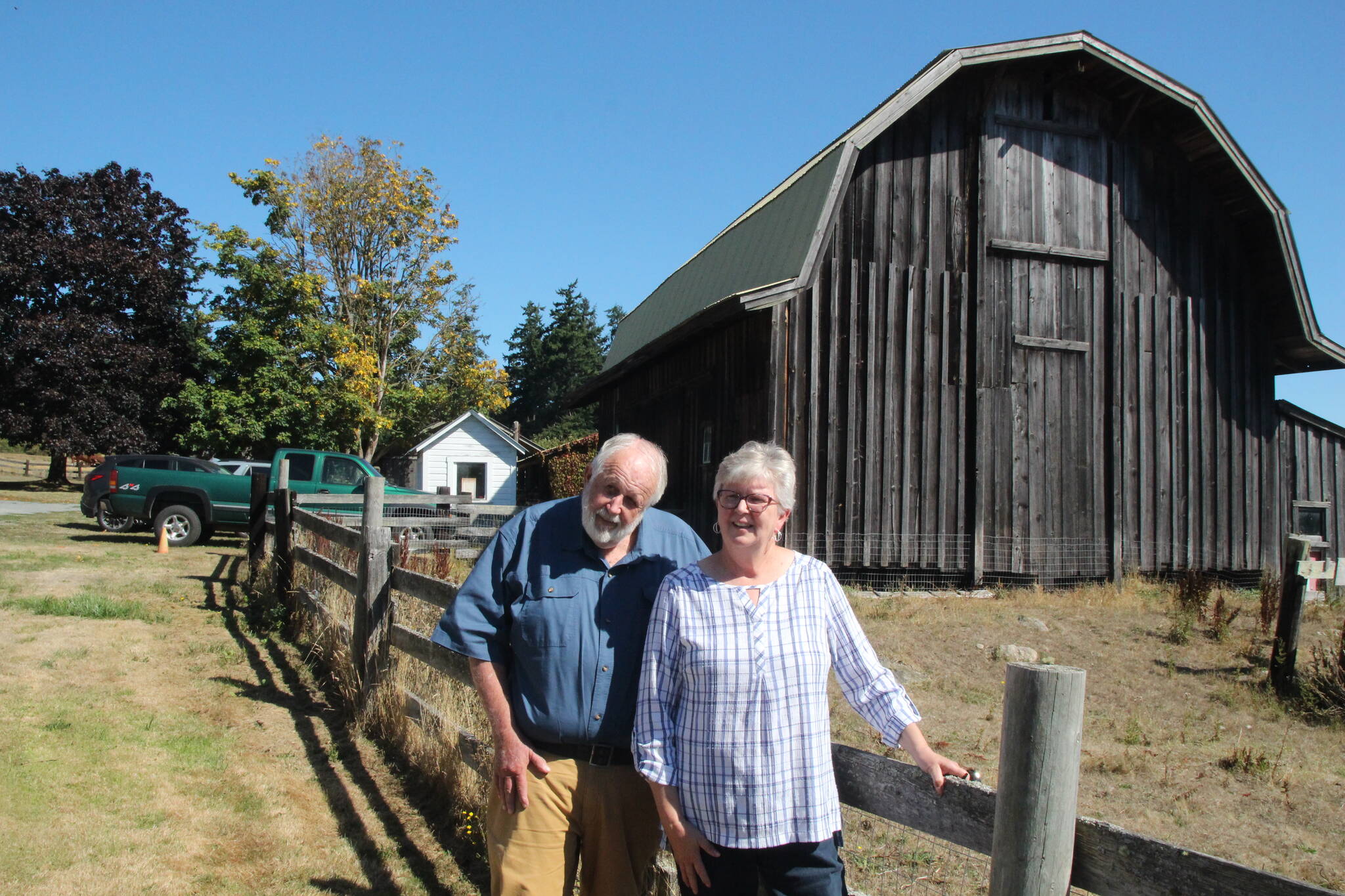 (Photo by Marina Blatt) Ruth and Hank Hilberdink pose in front of the historic barn.
