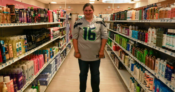 Stacie Lanners, 41, stands in the pharmacy where she has been employed for 20 years. She will be celebrating her 20th anniversary this Friday.