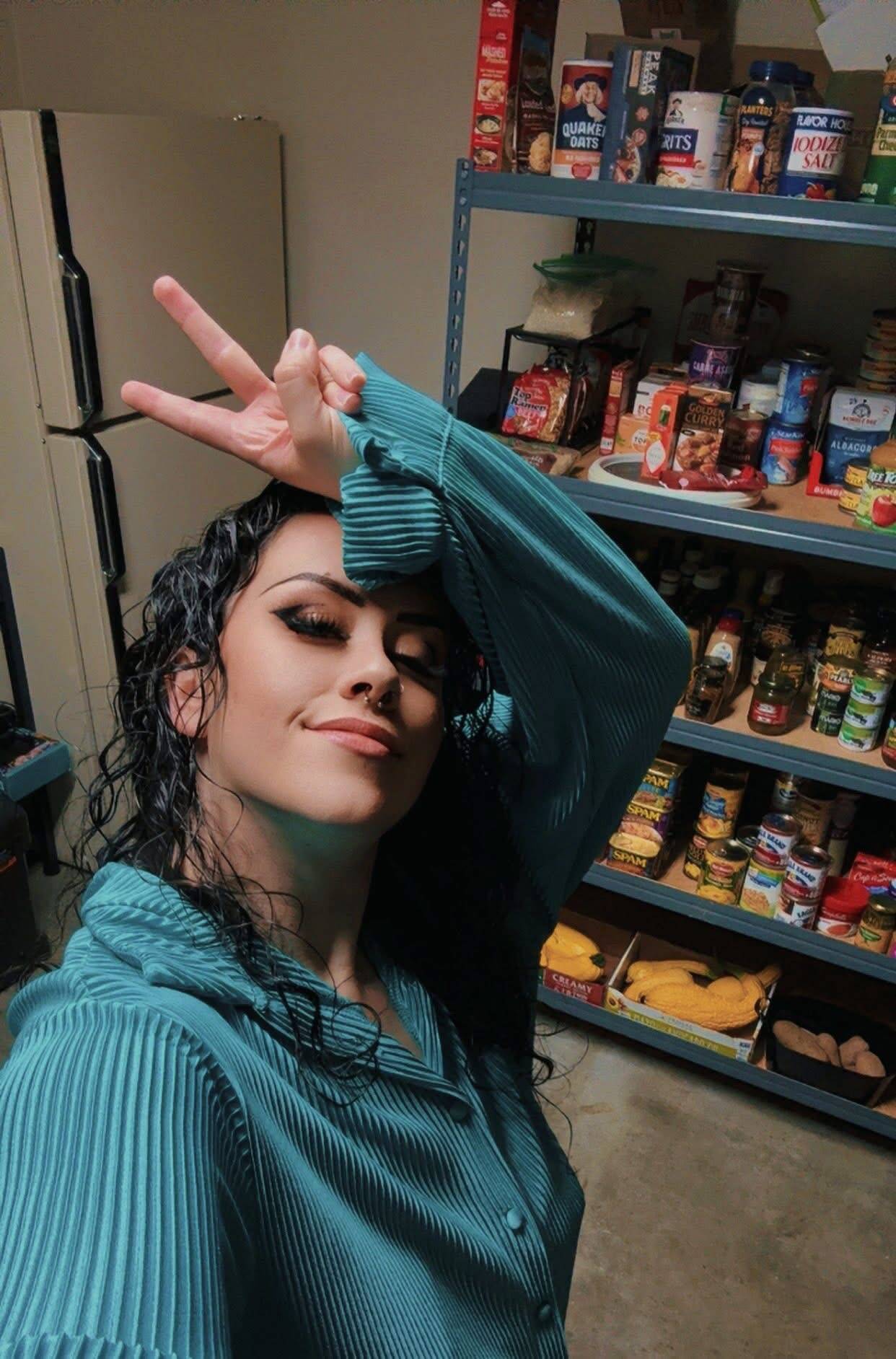 Krista Vanicsek poses in front of her food pantry. (Photo provided)