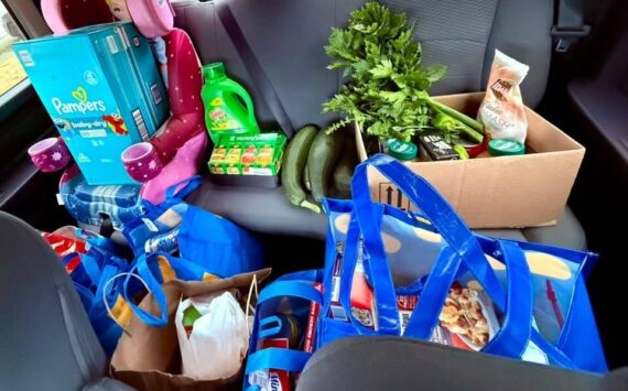Krista Vanicsek loads her car up with produce for the food pantry. (Photo provided)