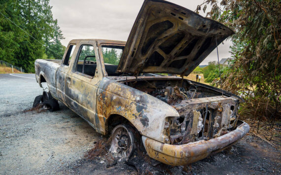 Photo by David Welton
Island County Commissioners are wondering if more can be done to reduce the cost of hauling old and abandoned vehicles, such as this one that suffered catastrophic damage from a fire.