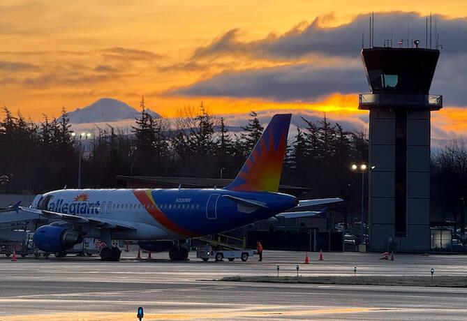 (Photo provided) A plane is parked at the Bellingham International Airport in front of a surreal Washington sunset.