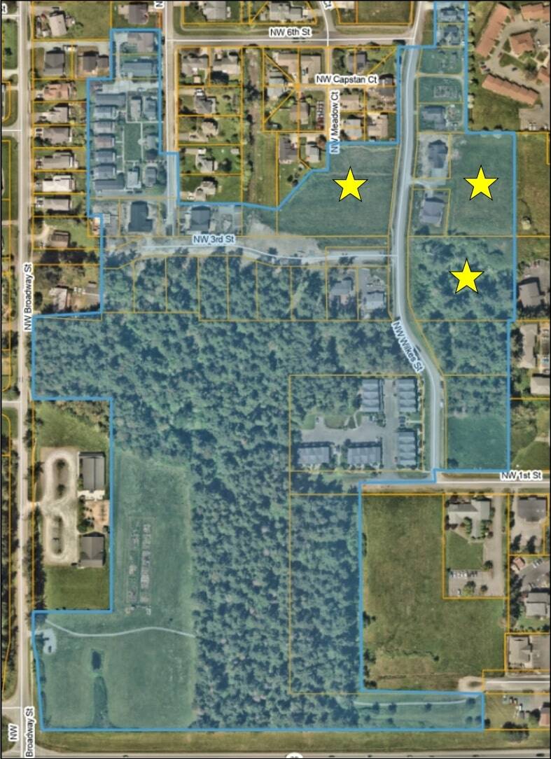 Photo provided
An aerial photo of the 33-acre property involved in the agreement taken in 2024, included in materials provided to the council; the stars indicate the location of the three undeveloped parcels in question.