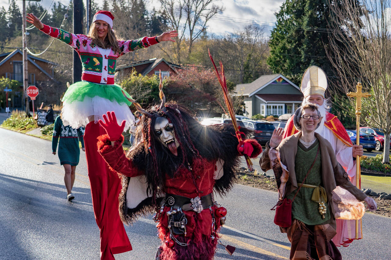 Photo by David Welton 
Lady Klinkerbell Krampus, Whidbey Island’s very old Krampus, walked along with Saint Nick, a long-legged elf and many other creative characters during the Holly Jolly Parade in Langley Saturday. While Lady Klinkerbell Krampus may look scary, she’s part of a Northern European tradition that celebrates whimsy and the mischievous side of the holidays, according to the Whidbey Island Fair website. The Langley parade was one of several community events held on Saturday to welcome the Christmas season.