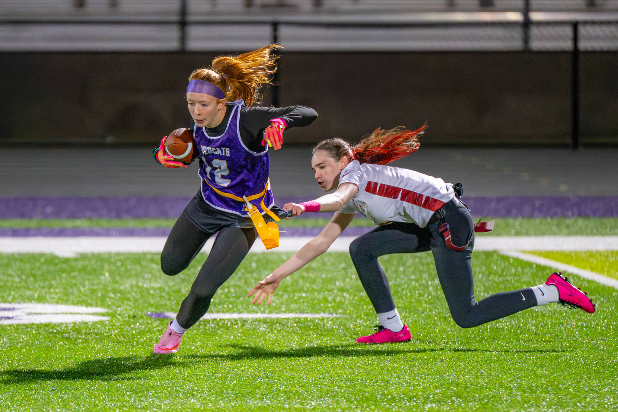 (Photos by Levi Evans, Oak Harbor High School Yearbook) Freshman Kenna Zwak runs the ball for the Wildcats in the teams game against Cascade on Wednesday.