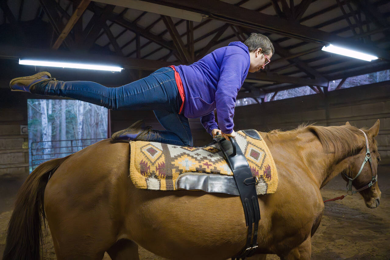 (Photo by David Welton) Jordan Jones kicks a leg up, while riding Gal, as Max Andrews guides her through moves with names that sound like menu items at an acrobatic café.