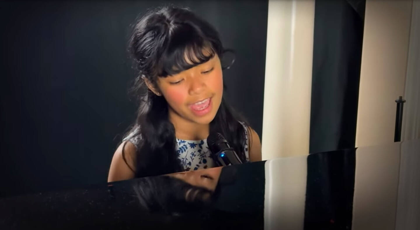 (Photo provided) Genelia Lai plays the piano as she sings a cover of Cant Help Falling in Love on her Youtube channel.